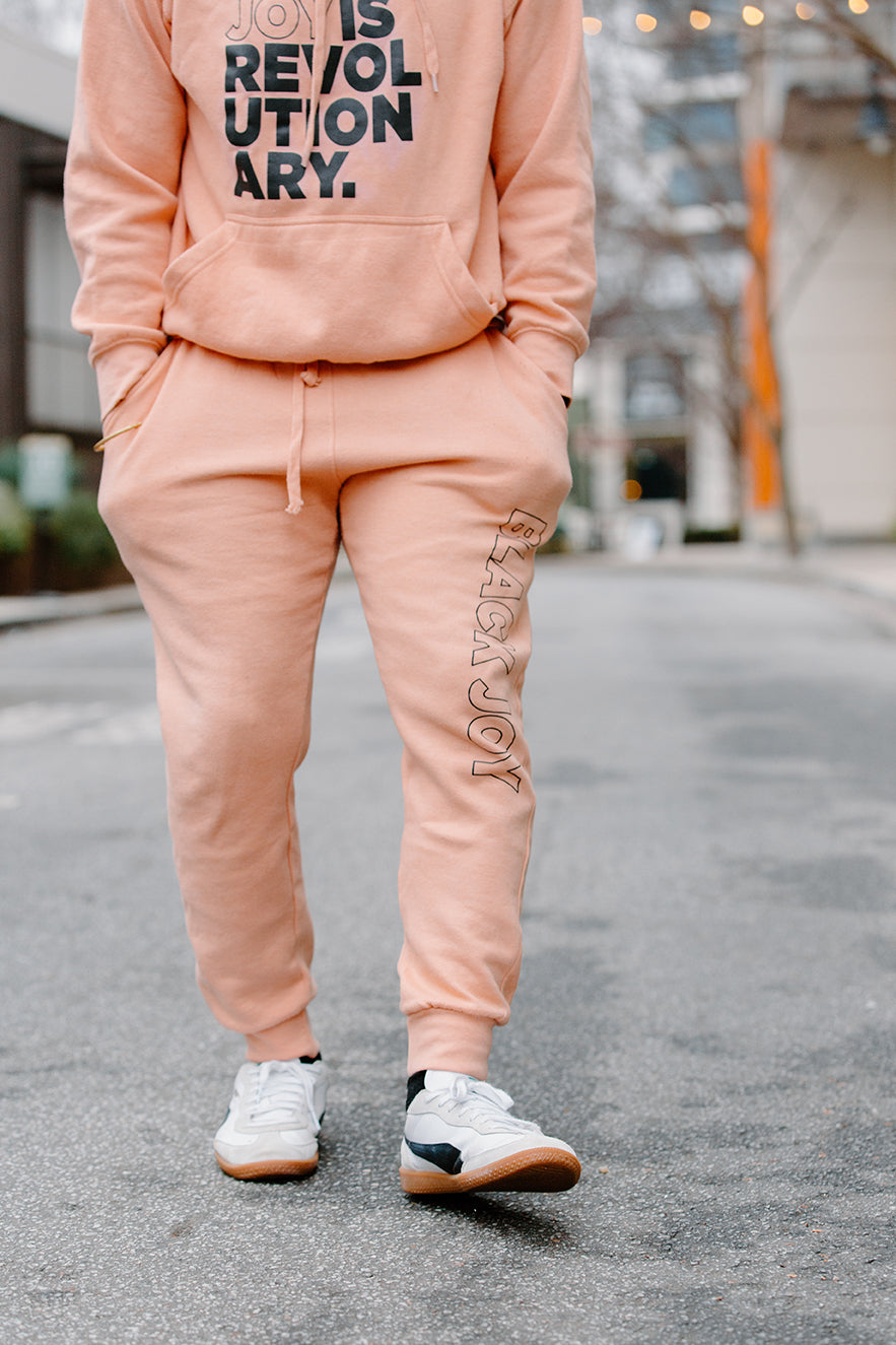 Black Joy Is Revolutionary (Sweatsuit)(Peach and Black)