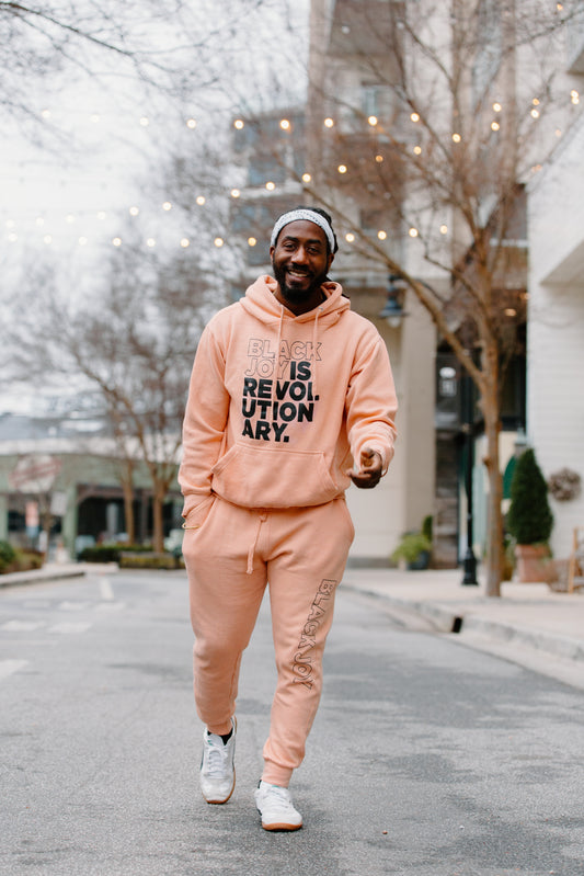 Black Joy Is Revolutionary (Sweatsuit)(Peach and Black)